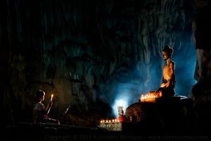 Woman in Buddhist cave
