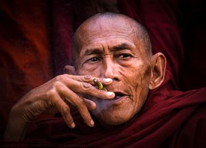 Buddhist monk with cigar