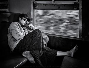 Young man relaxing on a train