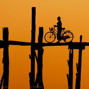 Bicycle and sunset at U Bein Bridge